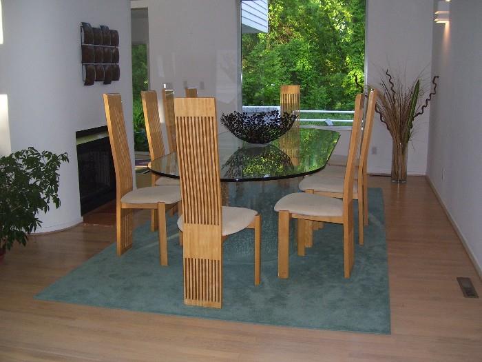 Beautiful glass dinning table and 8 high back chairs.