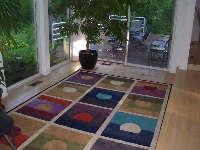 One of many area rugs and plants.