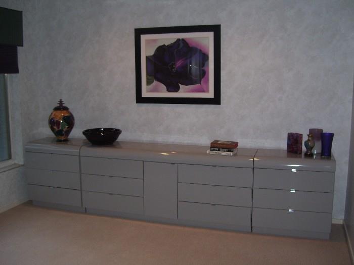Dresser, with a variety of art and accent pieces.