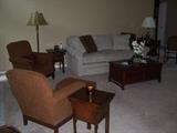 Living room furniture. including Hooker end tables and Thomasville chairs.