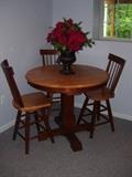 High top table and 3 chairs.