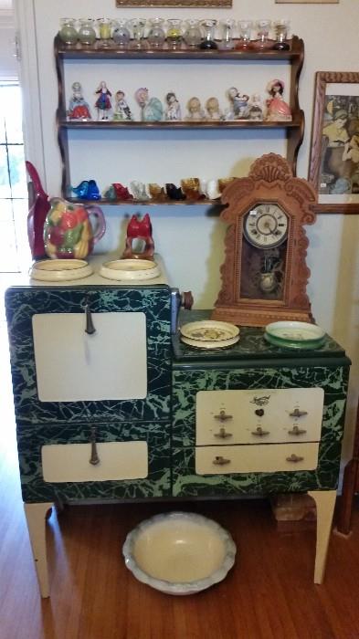 1920's Magic Chef stove.  Several antique kitchen/mantle clocks.  Lots of smalls and figurines.