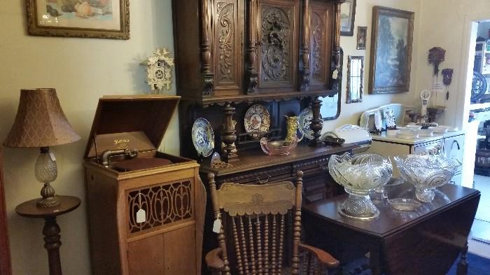 Beautiful furniture with exquisite late 1800's French breakfront.  One of several antique phonographs.  One of 2 drop leaf tables.  Tons of artwork.
