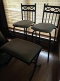 A couple of bar stools and an ottoman.