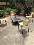 Outdoor fire pit and stacking chairs