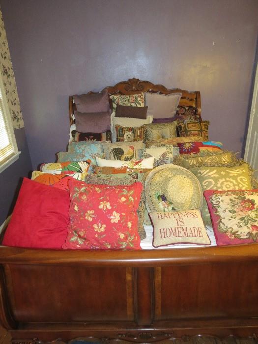 Lots of like new decorative pillows.  Bed not for sale.
