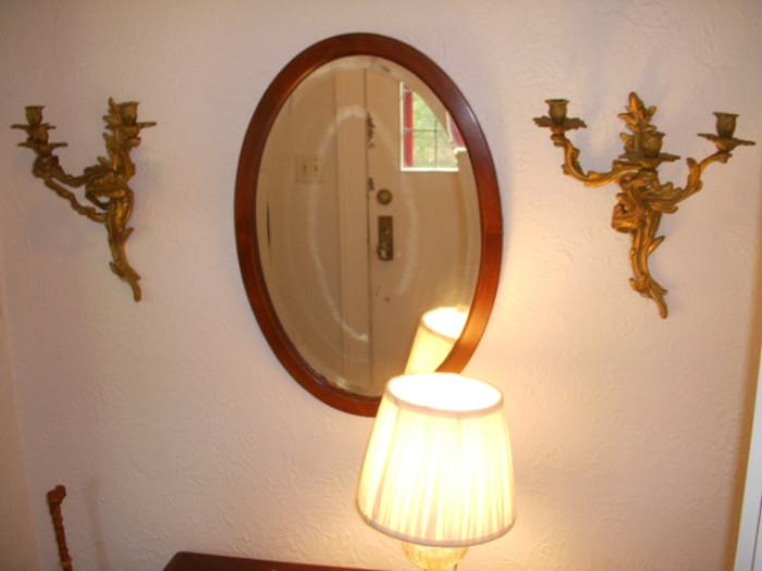 Cast brass sconces (each holds 3 candles), and beveled oval mirror