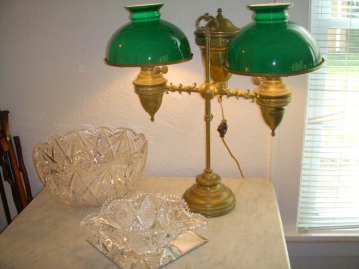 Cut glass punch bowl with 10 cups (bowl has interior fine scratches from use), Elongated cut glass bowl, Impressive Edward Miller brass student lamp with 10" cased glass shades, electrified many years ago