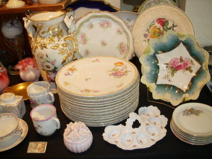 Porcelain.  Note the unusual crescent shaped egg dish
