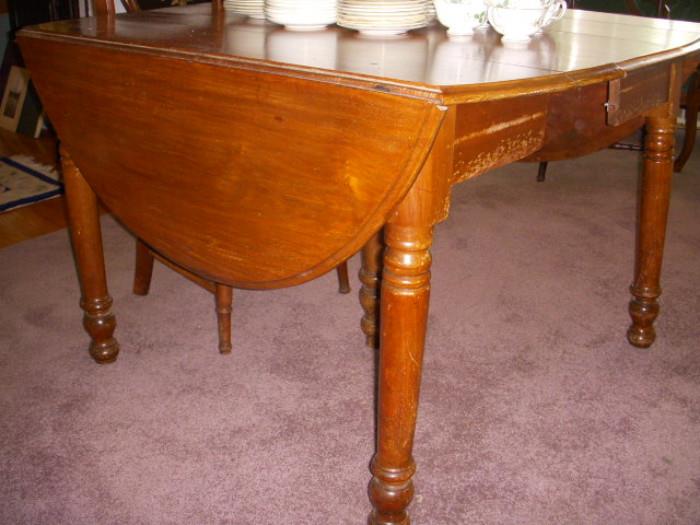 American walnut 19th century drop-leaf dining table with 2 more leaves (one in it now)...and a central fifth leg to prevent the table from sagging