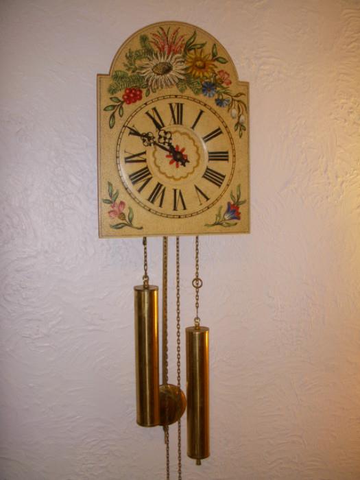 Wag-on-wall 8-day clock...strikes hour and half hour...works
