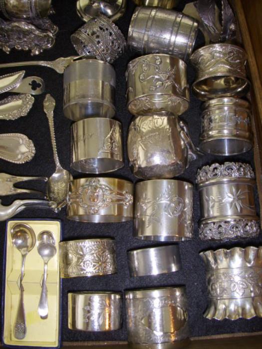Napkin rings.  Small spoons in fitter box are sterling