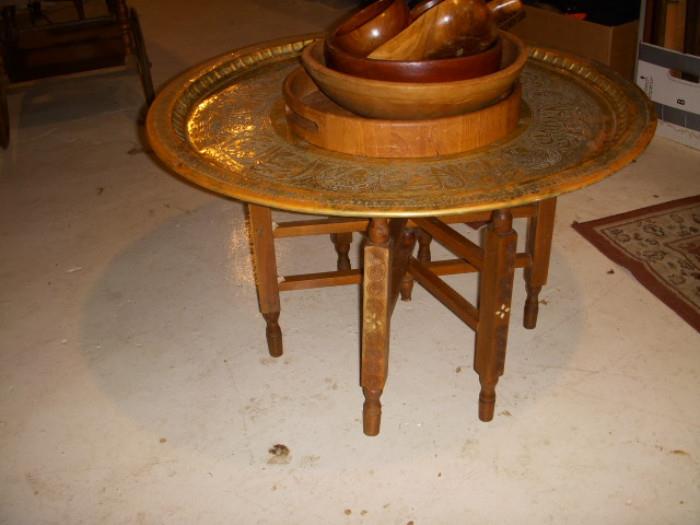 Brass tray table on folding wood base with inlay.