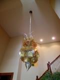 WOW! This stunning chandelier, titled "Golden Sun Chandelier" was created by artist Michael Roco. His gallery is located in Naples, FL. Here is link to his website: http://www.michaelmarceloroco.com/chandeliers-2 Owner said It is VERY easy to deal with, it is in 50-60 pieces that owner puts in the dishwasher to clean!  Owners paid just under $20,000 for this gorgeous piece and we're selling it for $7500. Home is located in Champaign and owners will pay for shipping if needed. No tax! Please contact Whitney 2176496288 text/call with any questions and interest! Beautiful! 