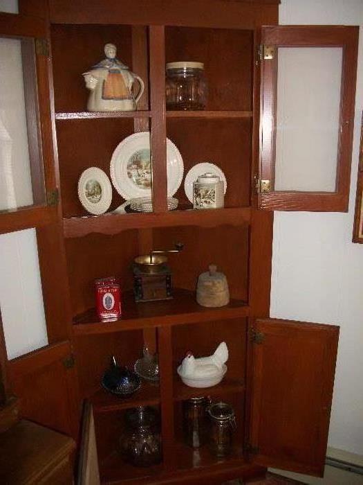 corner cabinet, with nesting chicken's, coffee grinder, butter pat, USA pitcher, and Currier & Ives set