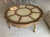Large round coffee table with leather and gold detail