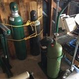 Acetylene Tanks, larger sold individually, smaller two are set on cart