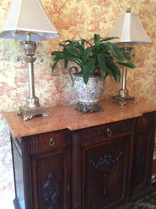 Gorgeous antique server/buffet with detailed carving and marble top; ornate planter and 2 identical lamps