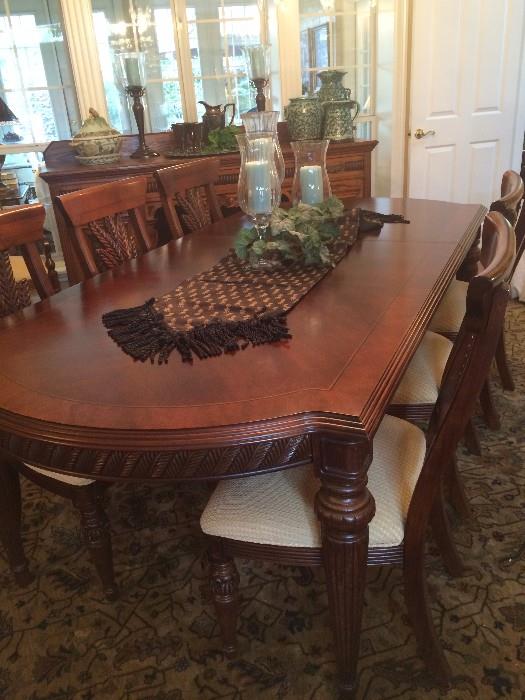 This elegant dining table has a total of 8 chairs.