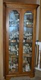 Curio Cabinet packed with Carousel Collectibles and other ceramics/porcelains