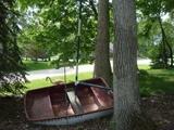 cute fiberglass boat, would look good in your yard!