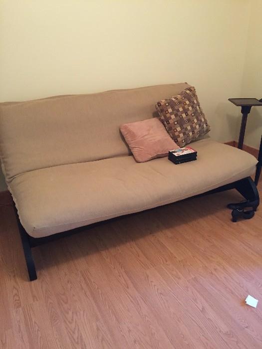 QUEEN SIZE FUTON WITH BEIGE COVER AND DARK WOOD BASE