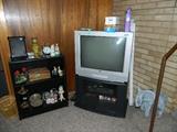 TV, TV stand, miscellaneous collectibles, 1 of several elephants