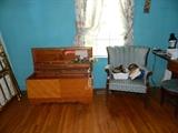 Vintage cedar chest, chair, hats, scarves. 