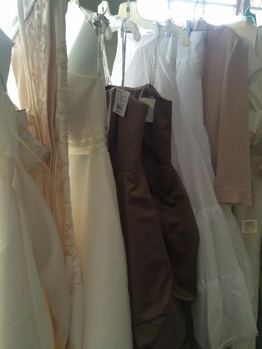 Several consigned wedding dresses an bridesmaid dresses