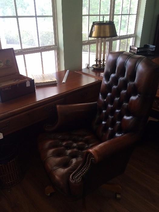 One of several desks; leather office chair