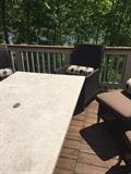 CHOCOLATE RATTAN CUSHIONED CHAIRS AND STONE TOP LONG PATIO TABLE