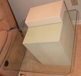 One of three glass table in a set