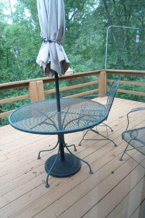 patio set, 2 chairs I think, also wooden glider on lower deck