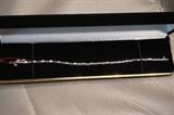 14K WG and diamond tennis bracelet. 19 diamonds approximately 3/4 CTW. 