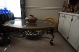 Oval table with glass top and metal base