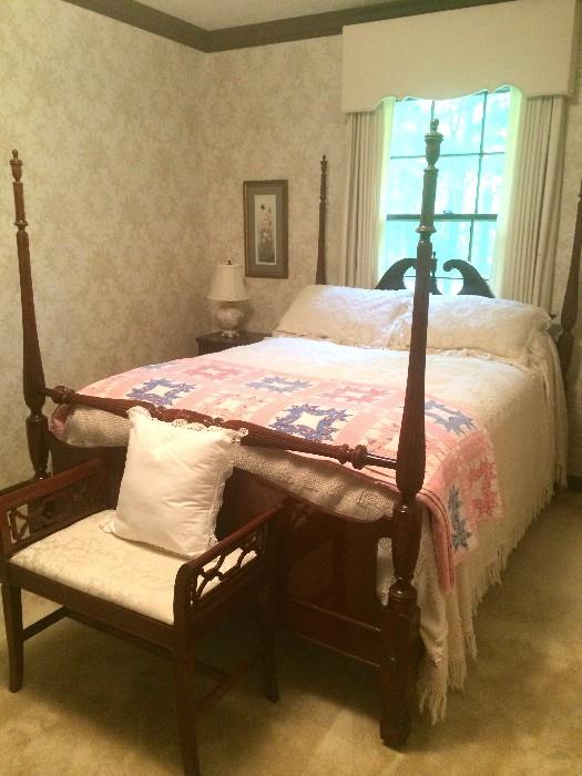 Gorgeous Duncan-Phyfe-style antique four-poster bed, back-less carved-side bench at foot; lovely vintage basket-motif coverlet with fringe and matching shams; handsewn antique quilt