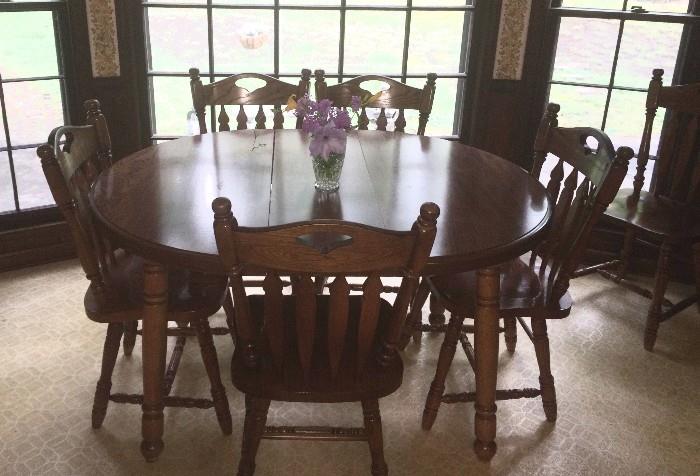 Sold kitchen dining table and six extremely sturdy chairs; table is round without leaves