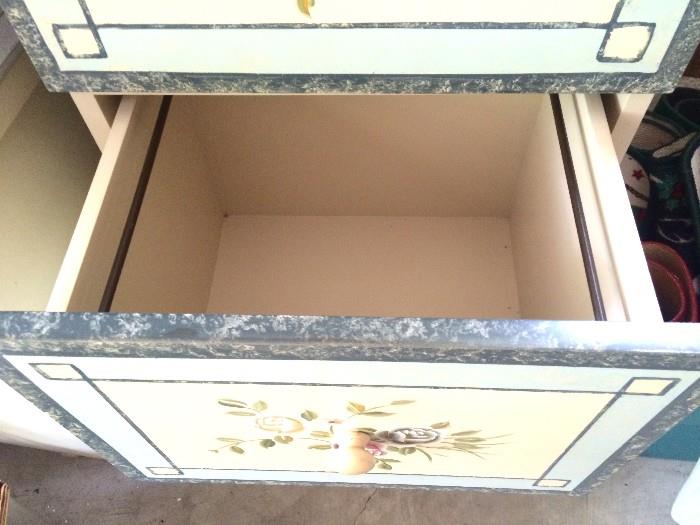 Insider drawer of painted file cabinet
