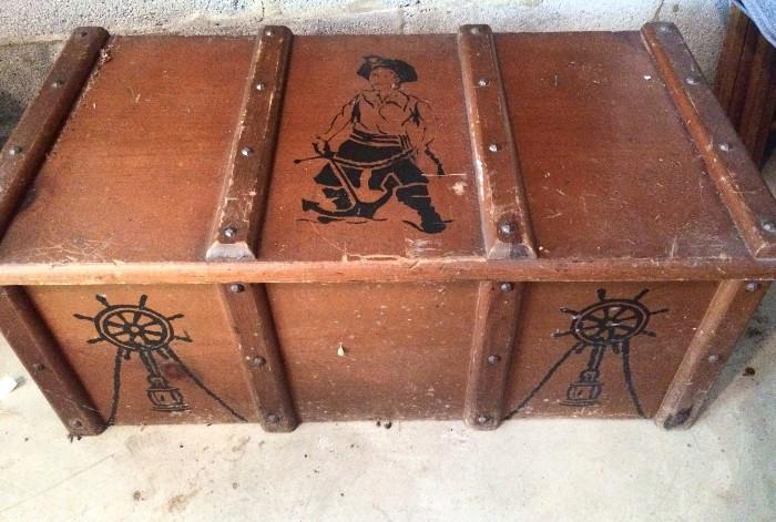 Mid-century wooden toybox with pirate imagery