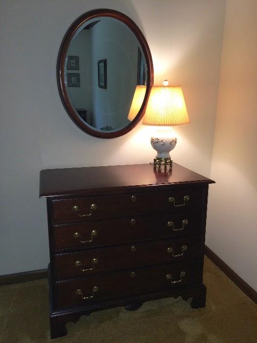 Traditional dresser and round antique bevelled mirror