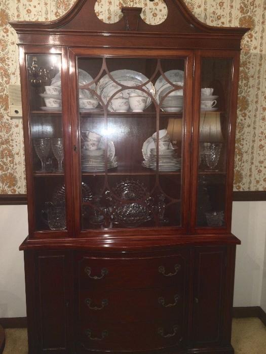 Duncan-Phyfe style antique china cabinet with three drawers