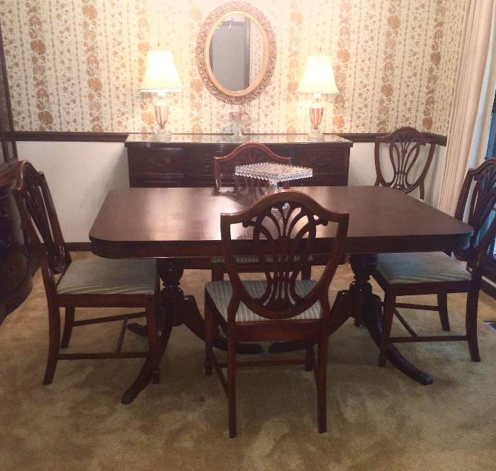 Duncan-Phyfe-style dining table with six chairs and leaf, very nice condition; matching buffet
