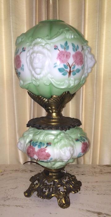 Antique GWTW lamp with raised-lion faces-- works beautifully top and bottom
