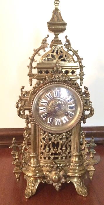 Stunning metal gilded clock with matching candleabras