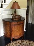Wood console cabinet with marble top, (42"W x 22D), three drawers, three doors. An excellent storage piece. Hand carved wood duck lamp with gunstock.