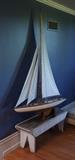 Large replica sailboat, with bench