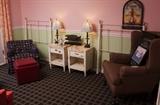 Assortment of end tables, arm chairs, twin beds, lamps