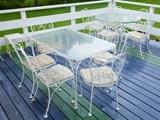 Outdoor metal patio furniture with custom granite seats, (won't blow over), Glass top metal tables. one round, one rectangular