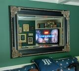 Large ornately framed beveled mirror. 64w x 45h x 3in profile