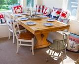 Rustic Country style pine dining table. Seats 8. Many Nautical throw pillows, Spode Dinner Plates, Pewter candle sticks, chairs